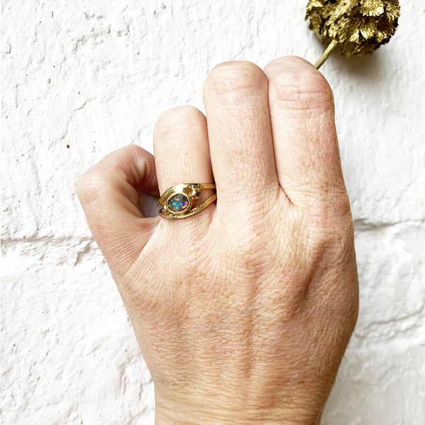 opal-white-sapphire-fairtrade-gold-nest-ring-on-model